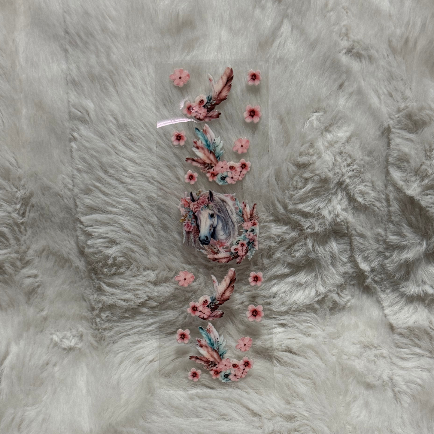 A rectangular UV DTF pen wrap featuring a horse portrait surrounded by pink flowers and feathers.