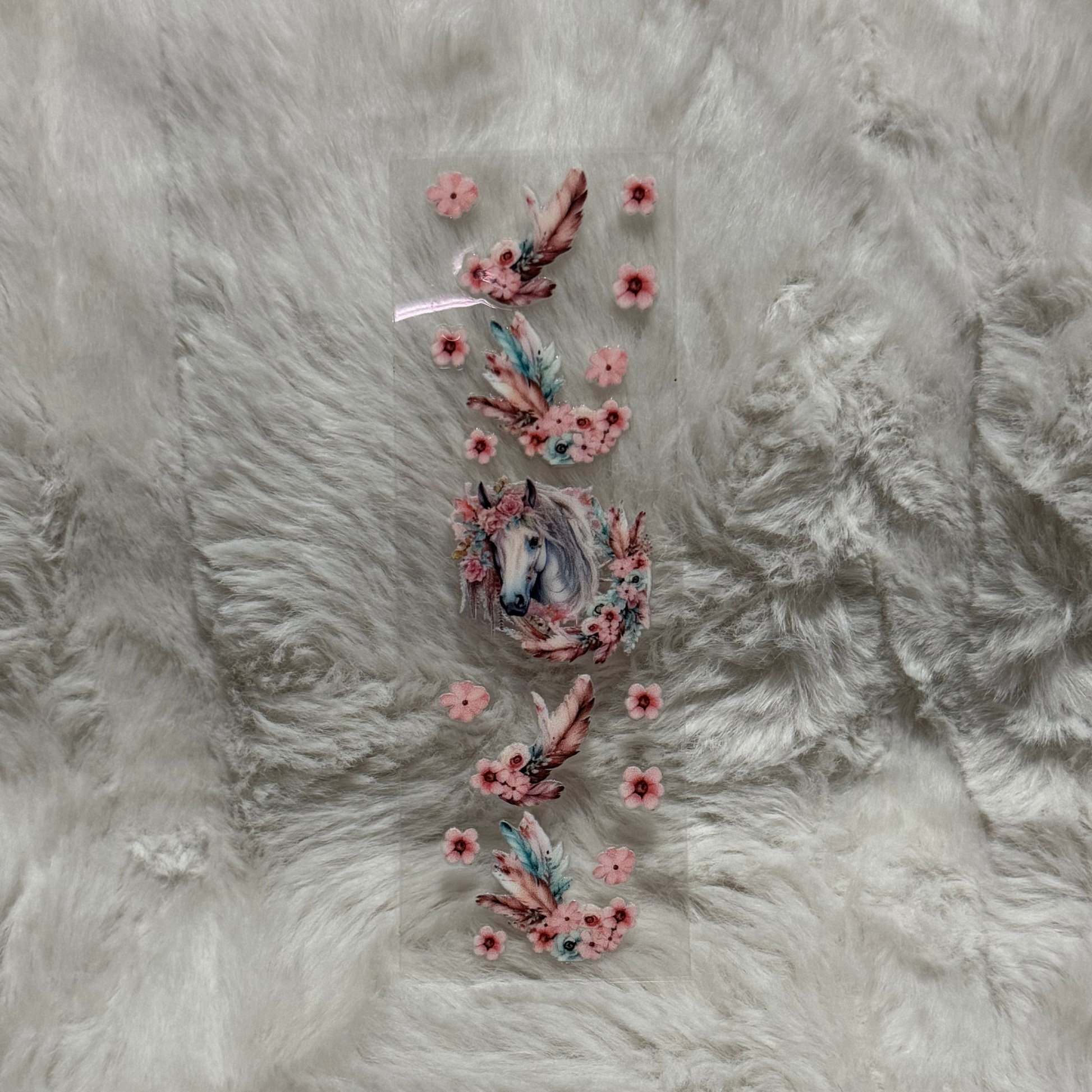 A rectangular UV DTF pen wrap featuring a horse portrait surrounded by pink flowers and feathers.
