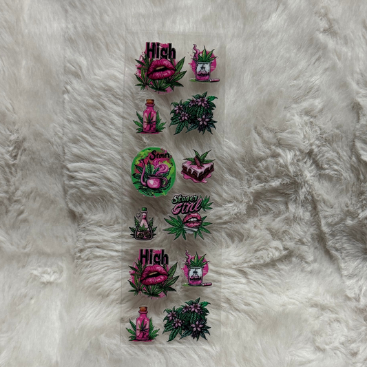 A sheet of UV DTF adhesive pen wraps featuring pink lips, cannabis leaves, and potion designs.