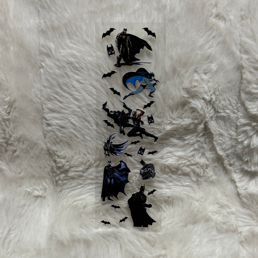 A clear UV DTF adhesive pen wrap featuring various Batman character illustrations and bat symbols.