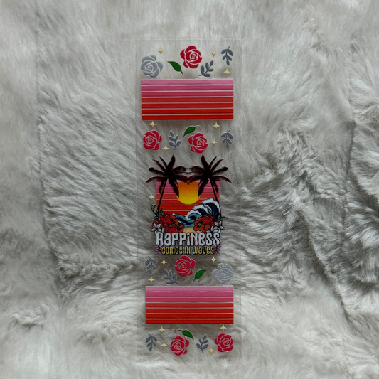 A rectangular UV DTF pen wrap featuring a sunset, palm trees, and the text Happiness Comes in Waves.