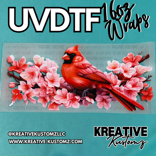 A UV DTF adhesive cup wrap featuring a red cardinal perched on a branch of pink cherry blossoms.
