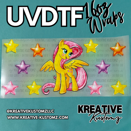 A UV DTF cup wrap featuring a yellow pony with a pink mane surrounded by colorful stars.